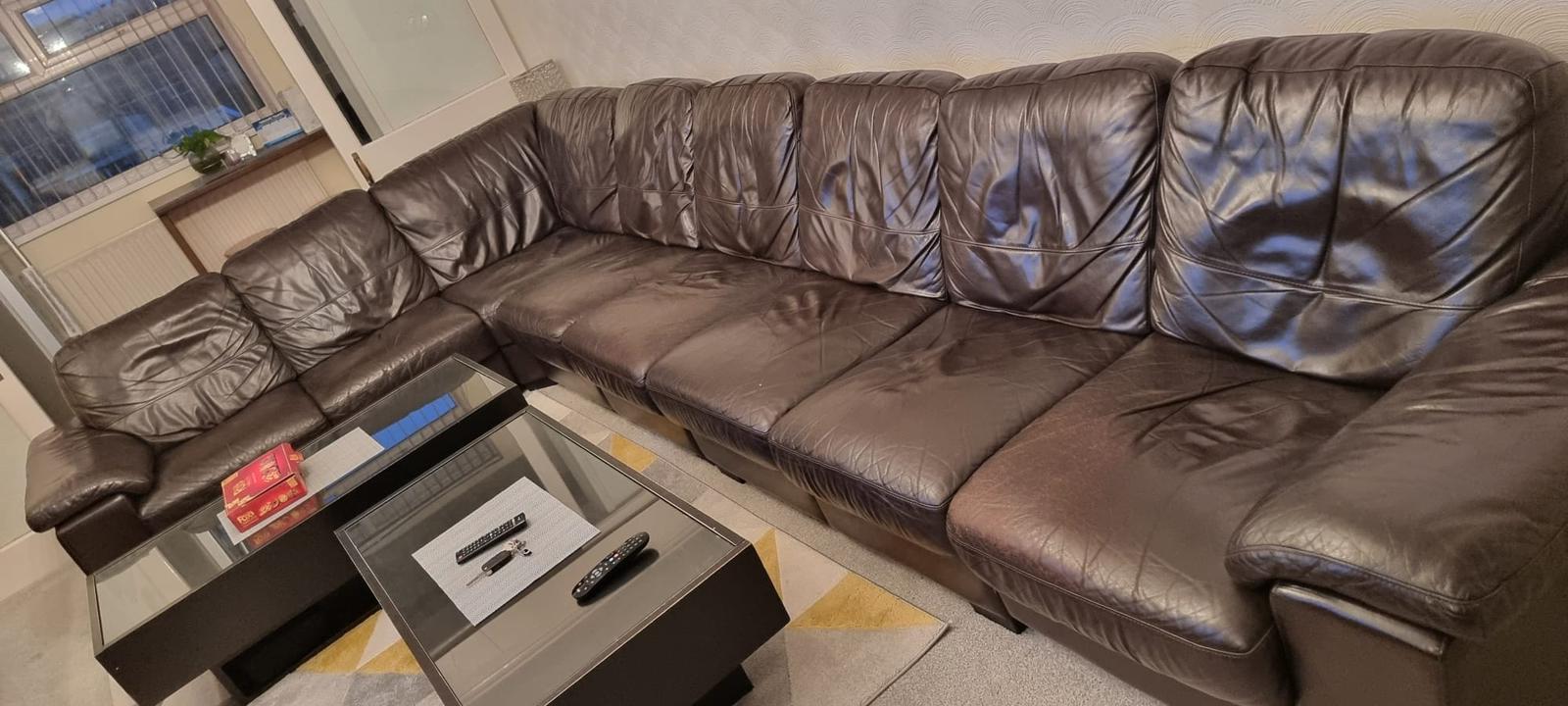 Damaged armchair with torn upholstery and sagging seat before TFRC’s restoration